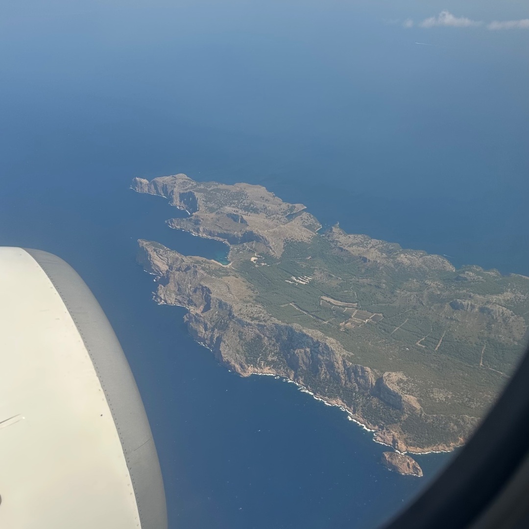 Aerial view of coastline from a plane window